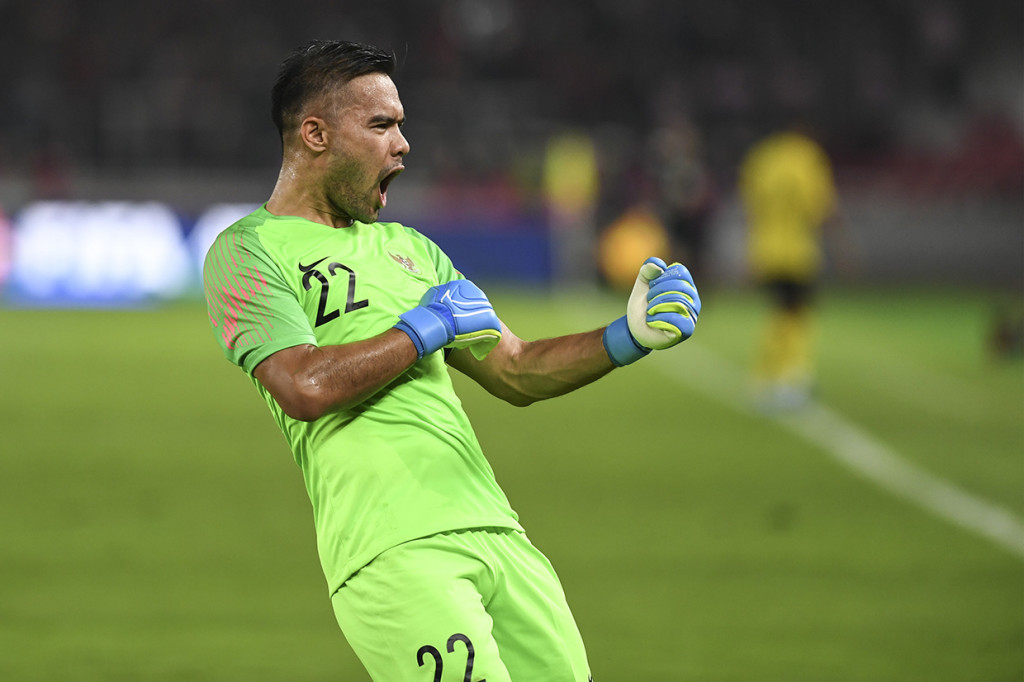 Kiper Timnas Indonesia Andritany Ardhiyasa meluapkan kegembiraan seusai Alberto Goncalves mencetak gol ke gawang Timnas Malaysia saat laga perdana Grup G Kualifikasi Piala Dunia 2022 zona Asia di Stadion Utama Gelora Bung Karno, Senayan, Jakarta. Antara Foto/Hafidz Mubarak A
