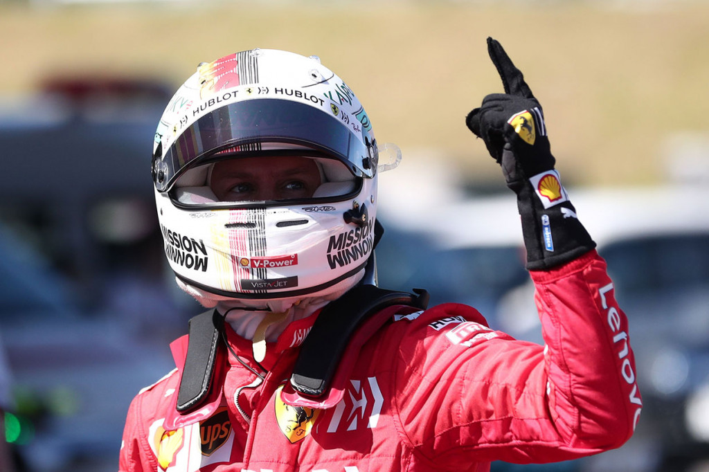 Pembalap Ferrari Sebastian Vettel melakukan selebrasi usai memastikan diri meraih pole position Grand Prix Jepang, setelah menjadi yang tercepat di babak kualifikasi di Suzuka, Minggu, 13 Oktober 2019 pagi. 