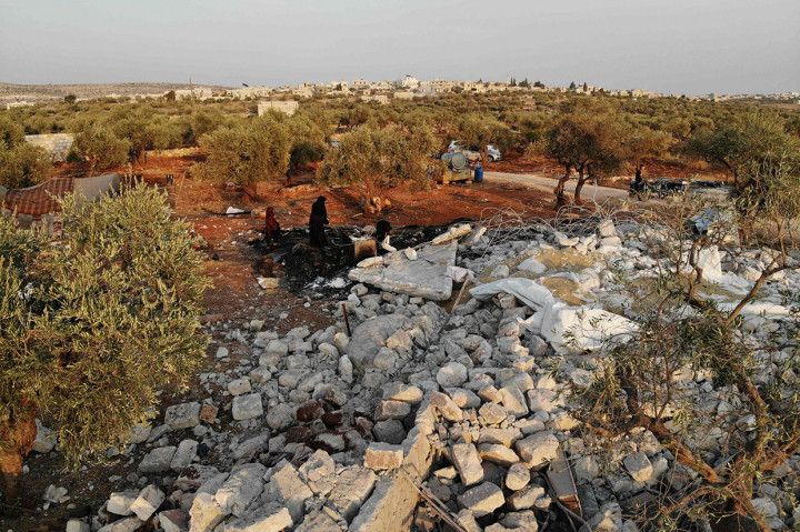 Trump menyebut serangan itu juga dibantu oleh Rusia, Suriah, Turki, dan Irak. AFP Photo/Omar Haj Kadour