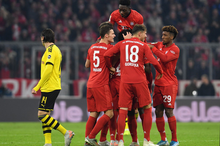 Laga Bayern Muenchen Vs Dortmund berakhir dengan skor 4-0 untuk kemenangan Die Roten, julukan Bayern. AFP Photo/Christof Stache
