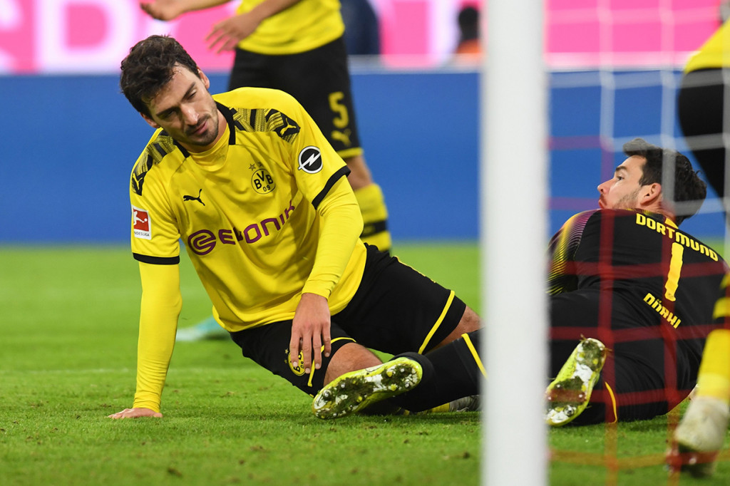 Adapun Dortmund menempati posisi kelima dengan 19 poin dari 11 laga. AFP Photo/Christof Stache