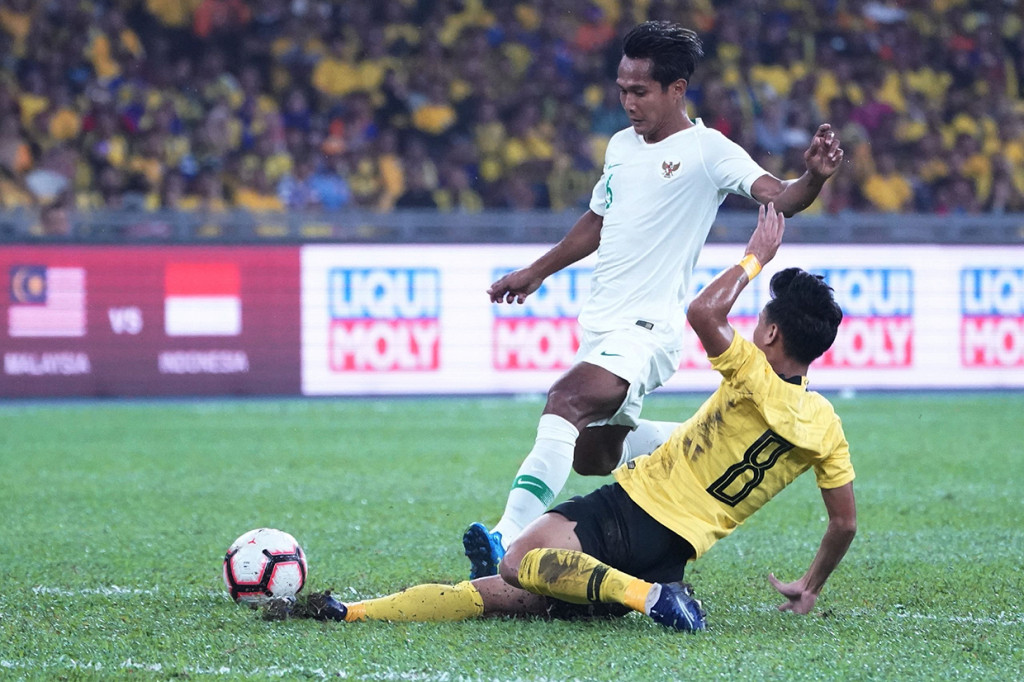 Pemain Malaysia, Muhammad Safawi Rasid, menjadi bintang dalam pertandingan tersebut lewat brace-nya pada menit ke-30 dan 73. AFP Photo/STR