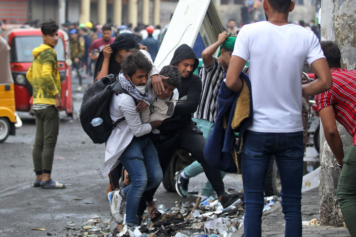 Sedikitnya 13 demonstran tewas ditembak dan sekitar 100 orang lainnya luka-luka, dengan beberapa di antaranya dalam kondisi kritis. AFP Photo/Ahmad Al-Rubaye