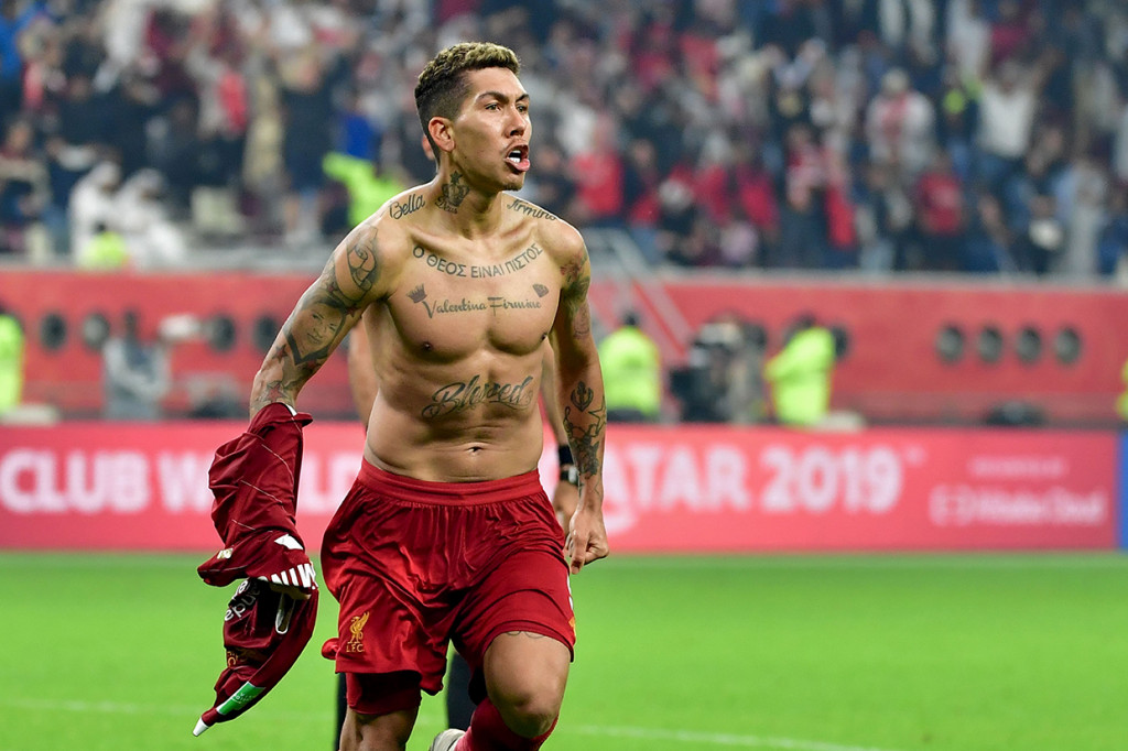 Striker Liverpool Roberto Firmino merayakan golnya ke gawang Flamengo pada laga final Piala Dunia Antarklub di Khalifa International Stadium in Doha, Qatar. AFP Photo/Giuseppe Cacace
