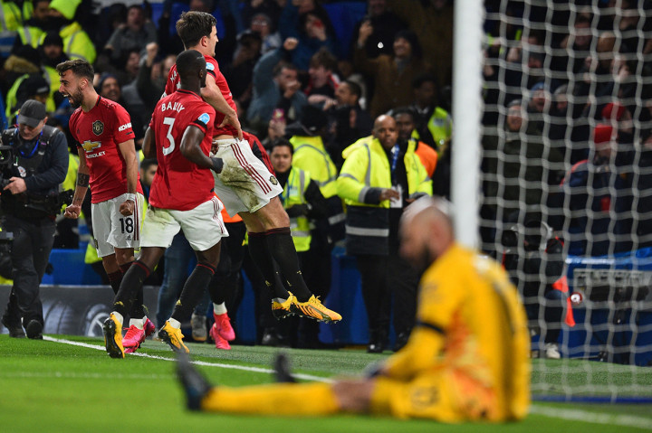 Harry Maguire melakukan selebrasi usai mencetak gol ke gawang Chelsea. AFP Photo/Glyn Kirk
