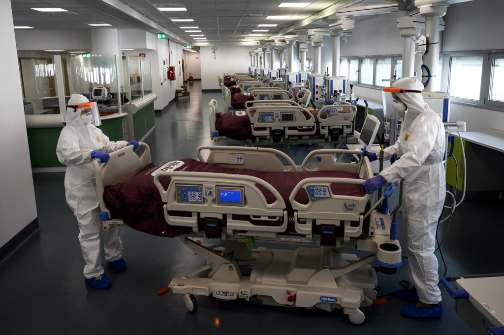 Dinas perlindungan sipil setempat melaporkan 756 kematian baru pada Minggu, 29 Maret 2020 waktu setempat. Tambahan saat itu menjadikan jumlah total korban meninggal akibat virus Korona di Italia mencapai 10.779 orang. AFP Photo/Marco Bertorello
