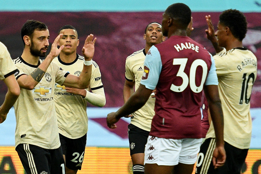 Manchester United menorehkan dua rekor dengan keberhasilan mengalahkan Aston Villa 3-0 dalam lanjutan Liga Inggris di Villa Park. AFP Photo/Oli Scarff