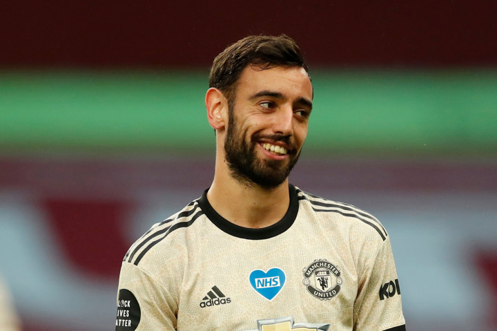 Selain rekor itu, dua pemain MU juga menorehkan catatan apik lain. Bruno Fernandes sudah memberi 6 assist dalam 10 laga terakhir Liga Inggris. Ia menyamai rekor Arjen Robben, Ángel Di María, Mesut Ozil, Lee Sharpe, David Ginola, dan Dusan Tadic. AFP Photo/Andrew Boyers