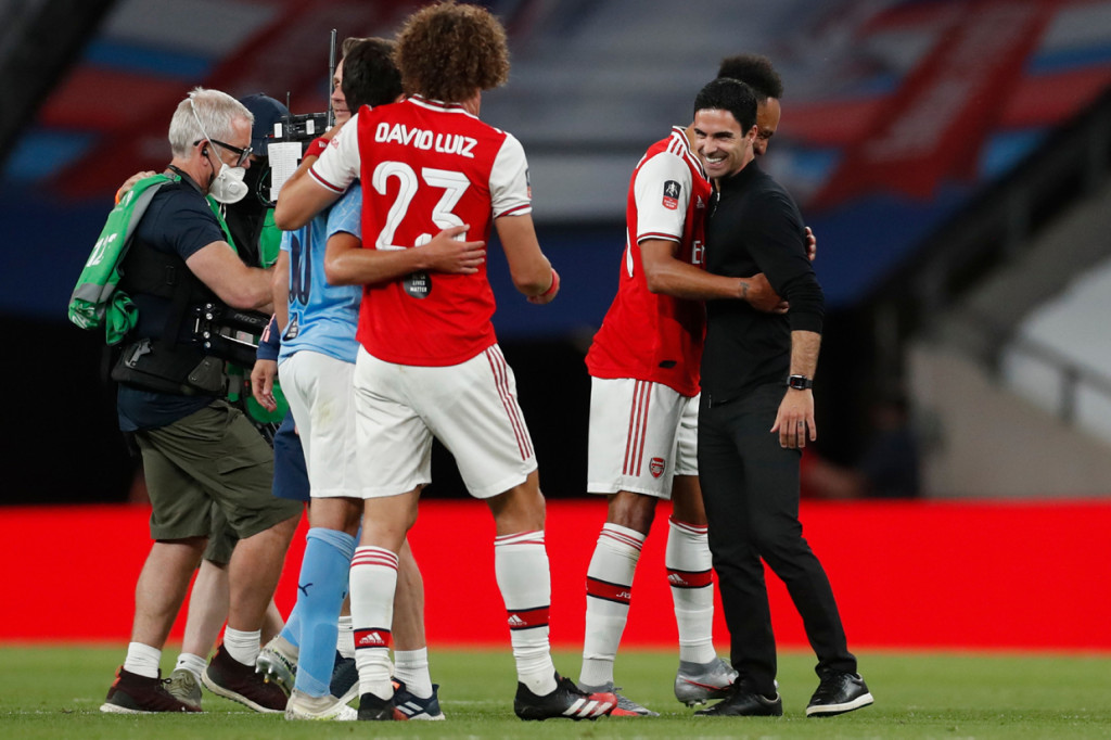 Bagi Arsenal, kepastian melenggang ke partai puncak menghasilkan rekor kelolosan mereka untuk ke-21 kalinya menuju final Piala FA. AFP Photo/Matthew Childs