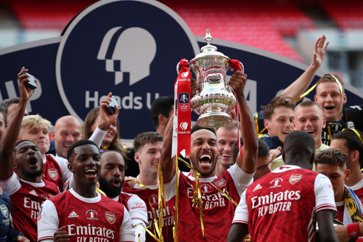 Kegembiraan pun terlihat jelas dari wajah pemain-pemain Arsenal. AFP Photo/Adam Davy