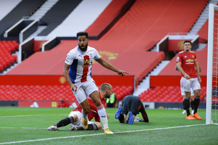 Andros Townsend melakukan selebrasi usai mencetak gol ke gawang Manchester United. AFP Photo/Richard Heathcote