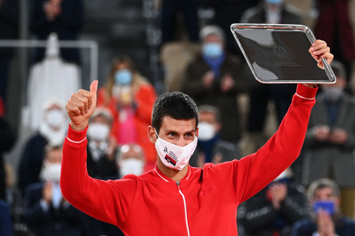 Sementara bagi Novak Djokovic, ini adalah kekalahan ketiganya dari Rafael Nadal dalam partai puncak French Open. Dia tercatat hanya sekali memenangkan turnamen lapangan tanah paling bergengsi di dunia tersebut, yaitu pada 2016 dimana dia mengalahkan Andy Murray pada partai final. AFP Photo/Anne-Christine Poujoulat
