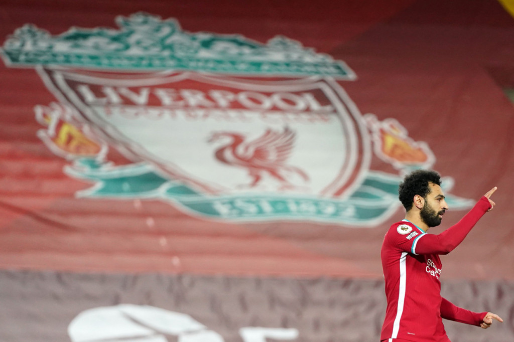 Mohamed Salah melakukan selebrasi usai mencetak gol ke gawang West Ham. AFP Photo/Jon Super