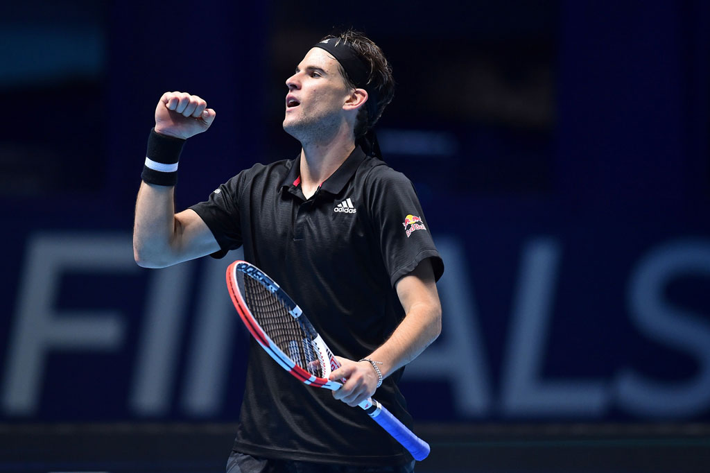 Petenis Austria Dominic Thiem melakukan selebrasi usai mengalahkan Rafael Nadal dengan skor 7-6(7), 7-6(4) pada turnamen ATP World Tour Finals di London, Selasa, 17 November 2020 waktu setempat.