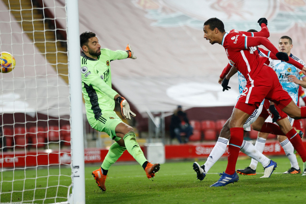 Joel Matip ikut menjebol gawang Wolverhampton Wanderers pada menit ke-67. AFP Photo/Clive Brunskill