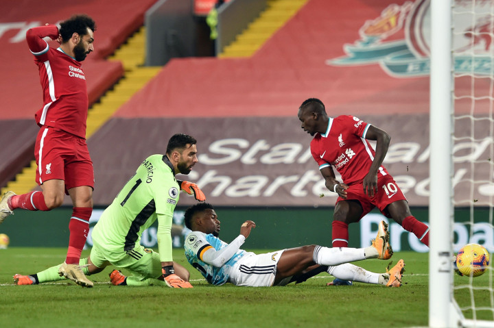 Pesta gol Liverpool ditutup oleh Nelson Semedo. Bek asal Portugal itu mencetak gol bunuh diri saat salah mengantisipasi umpan silang Trent Alexander-Arnold. Bola sapuannya justru masuk ke gawang sendiri. AFP Photo/Peter Powell