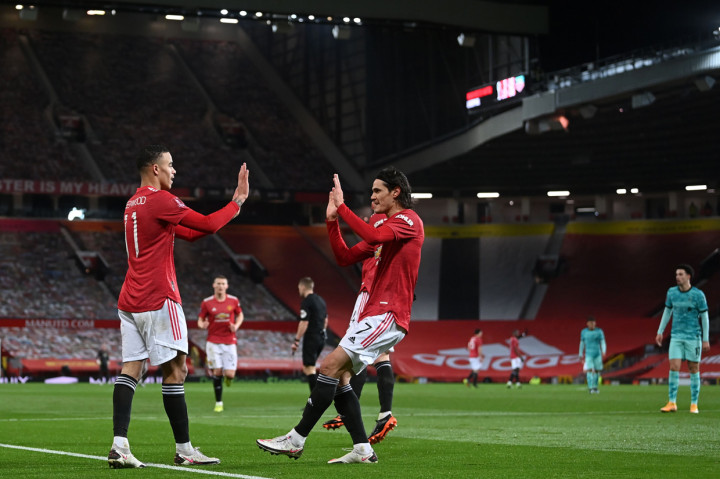 Tidak lama berselang, United cepat menyamakan kedudukan. Berawal dari umpan Marcus Rashford ke lini depan, lalu bola menghampiri Mason Greenwood.  AFP Photo/Laurence Griffiths