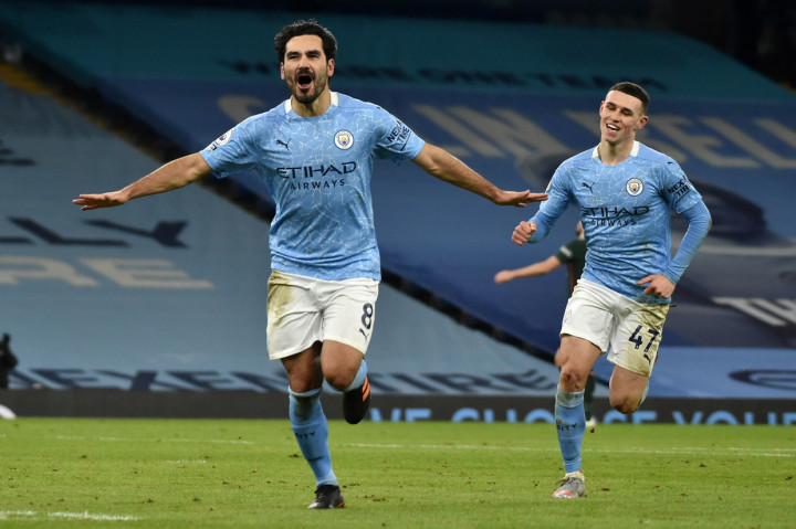 Ilkay Gundogan melakukan selebrasi usai mencetak gol ke gawang Tottenham Hotspur. AFP Photo/Rui Vieira