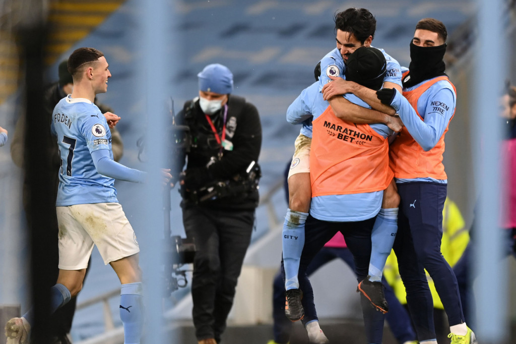 Sementara Man City kian kukuh di puncak klasemen Liga Inggris. Skuad besutan Pep Guardiola itu mengoleksi 53 poin dari 23 laga. AFP Photo/Shaun Botterill