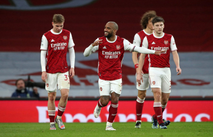 Alexandre Lacazette melakukan selebrasi usai mencetak gol ke gawang Tottenham Hotspur.
