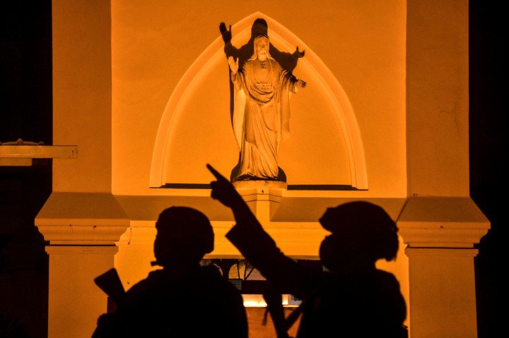 Ribuan personel gabungan dikerahkan untuk mengamankan sejumlah gereja di wilayah Indonesia, Kamis, 1 April 2021. Penjagaan ketat dilakukan untuk kenyamanan umat jelang ibadah Paskah. AFP Photo/Indra Abriyanto