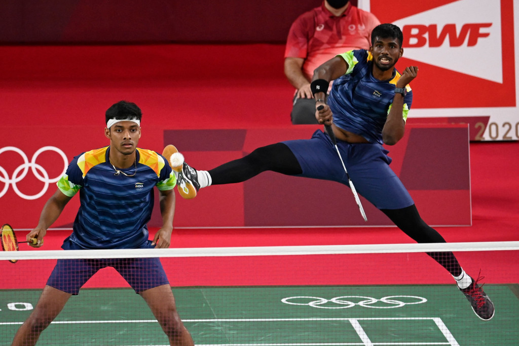 Bertanding di Musashino Forest Sport Plaza, Senin, 26 Juli 2021, Kevin/Marcus menang 21-13, 21-12 dan hanya butuh waktu 32 menit untuk menyudahi perlawanan wakil India itu.