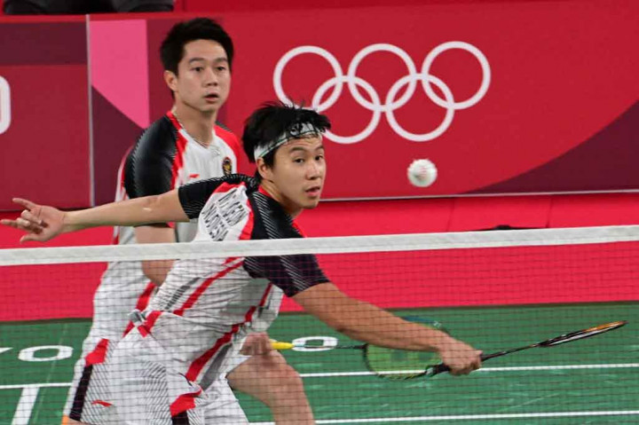 Ganda putra andalan Indonesia Kevin Sanjaya Sukamuljo-Marcus Fernaldi Gideon harus mengakui keunggulan ganda Malaysia Soh Wooi Yik-Aaron Chia di perempat final Olimpiade Tokyo 2020.