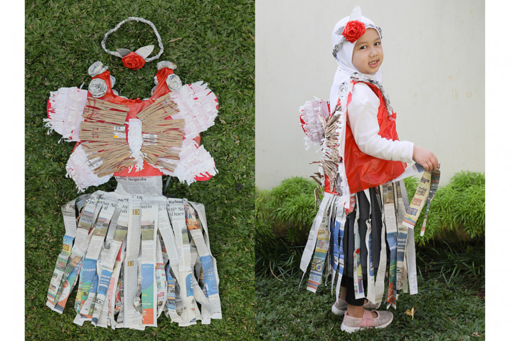 Giana Hanifah Zahara (5), Gaun kreasi kupu-kupu menggunakan koran, potongan kardus dan hiasan kantong plastik bekas sisa belanja online. 