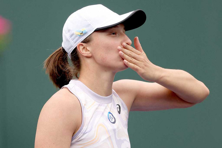 Juara bertahan Iga Swiatek melaju mudah ke babak kedua Indian Wells dengan kemenangan mudah 6-0, 6-1 atas petenis AS peringkat 56 Claire Liu,  Minggu, 12 Maret 2023 WIB.