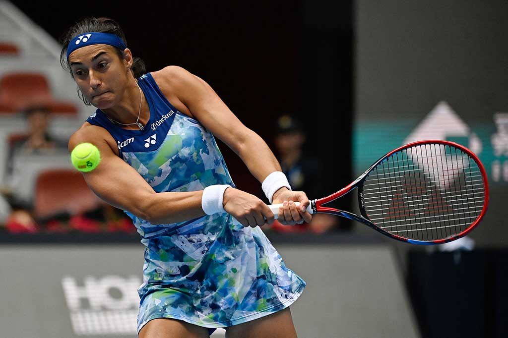 Set pembuka yang menegangkan memuncak dengan tie-break maraton yang akhirnya dimenangkan Garcia -- yang berada di peringkat 10 -- dengan pukulan passing yang kejam.