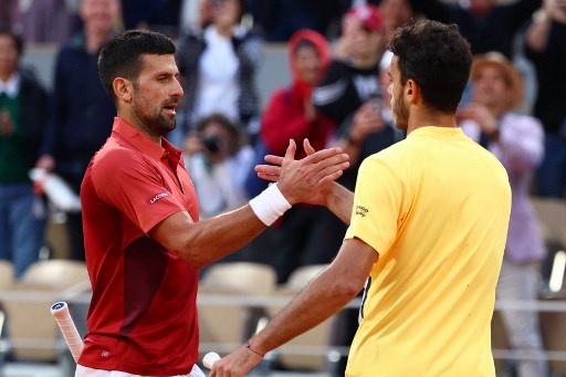 Djokovic yang tertatih-tatih tampak akan mengalami kekalahan mengejutkan ketika tertinggal pada set keempat, namun kemudian bangkit untuk menang 6-1, 5-7, 3-6, 7-5, 6-3 dalam waktu empat jam 39 menit.