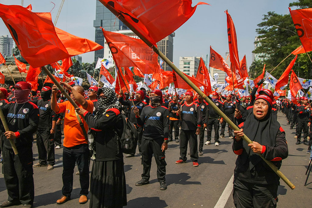 Massa buruh dari berbagai organisasi berunjuk rasa menolak iuran Tabungan Perumahan Rakyat (Tapera) di kawasan Patung Kuda, Jakarta, Kamis, 6 Juni 2024. 