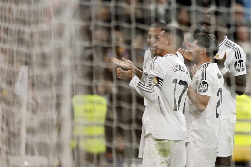 Real Madrid berhasil menggeser Barcelona dari peringkat dua setelah mengalahkan Sevilla 4-2 dalam lanjutan LaLiga 2024/25 pekan ke-18 di Santiago Bernabeu, Minggu, 22 Desember 2024 WIB.