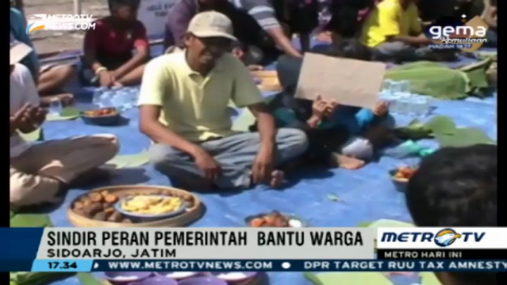 Puluhan Korban Lumpur Lapindo Gelar Tumpengan di Atas Tanggul