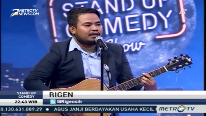 Rigen Bawakan Berita dengan Gitar