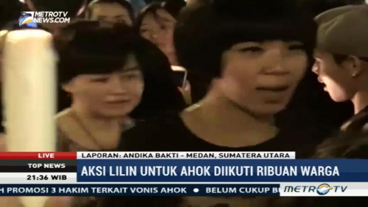 Diguyur Hujan, Aksi Lilin untuk Ahok di Medan Berlanjut