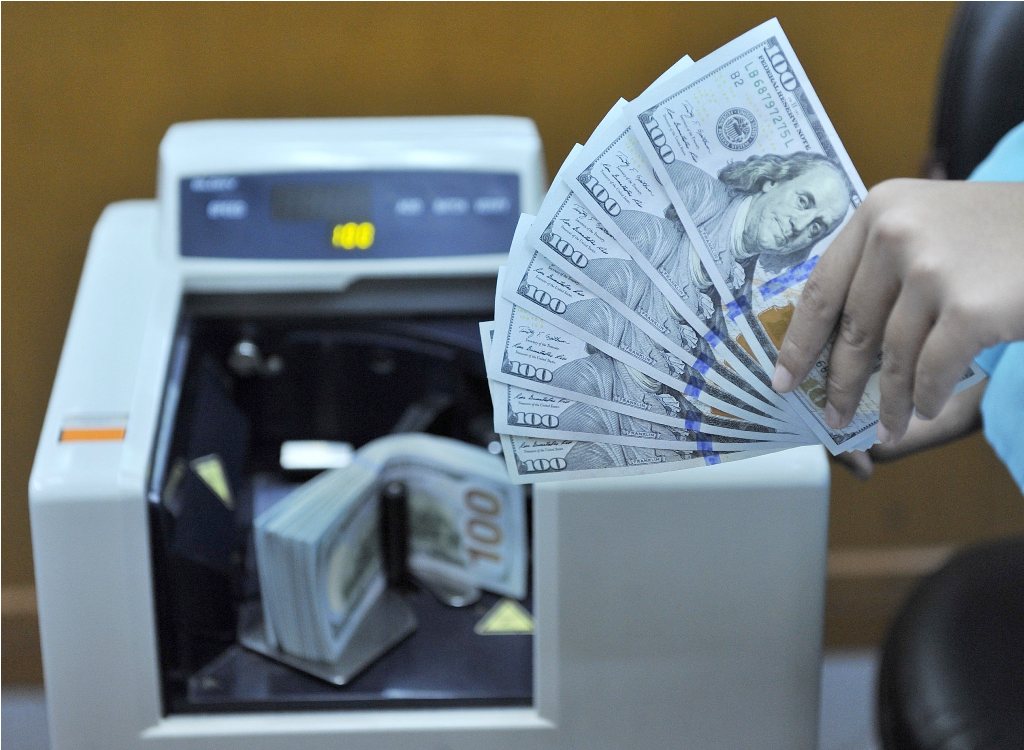 USD Tergelincir Usai Fed Naikkan Suku Bunga