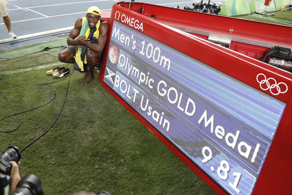 Raih <i>Hattrick</i> Emas, Usain Bolt Cetak Sejarah